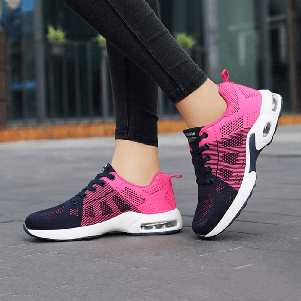 Unisex breathable wear-resistant lace-up cushioned running shoes in pink and navy, featuring lightweight mesh upper and rubber outsole.